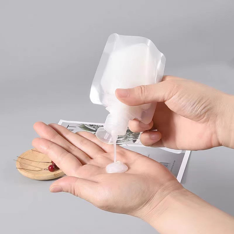 Travel toiletry bag for cosmetics, shampoo, lotion, shower gel, and facial cleanser; portable squeeze refillable bottles for travel and business trips