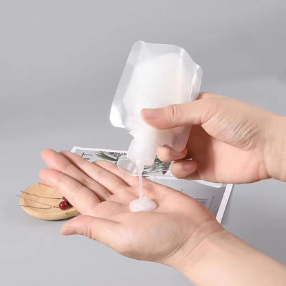 Travel toiletry bag for cosmetics, shampoo, lotion, shower gel, and facial cleanser; portable squeeze refillable bottles for travel and business trips