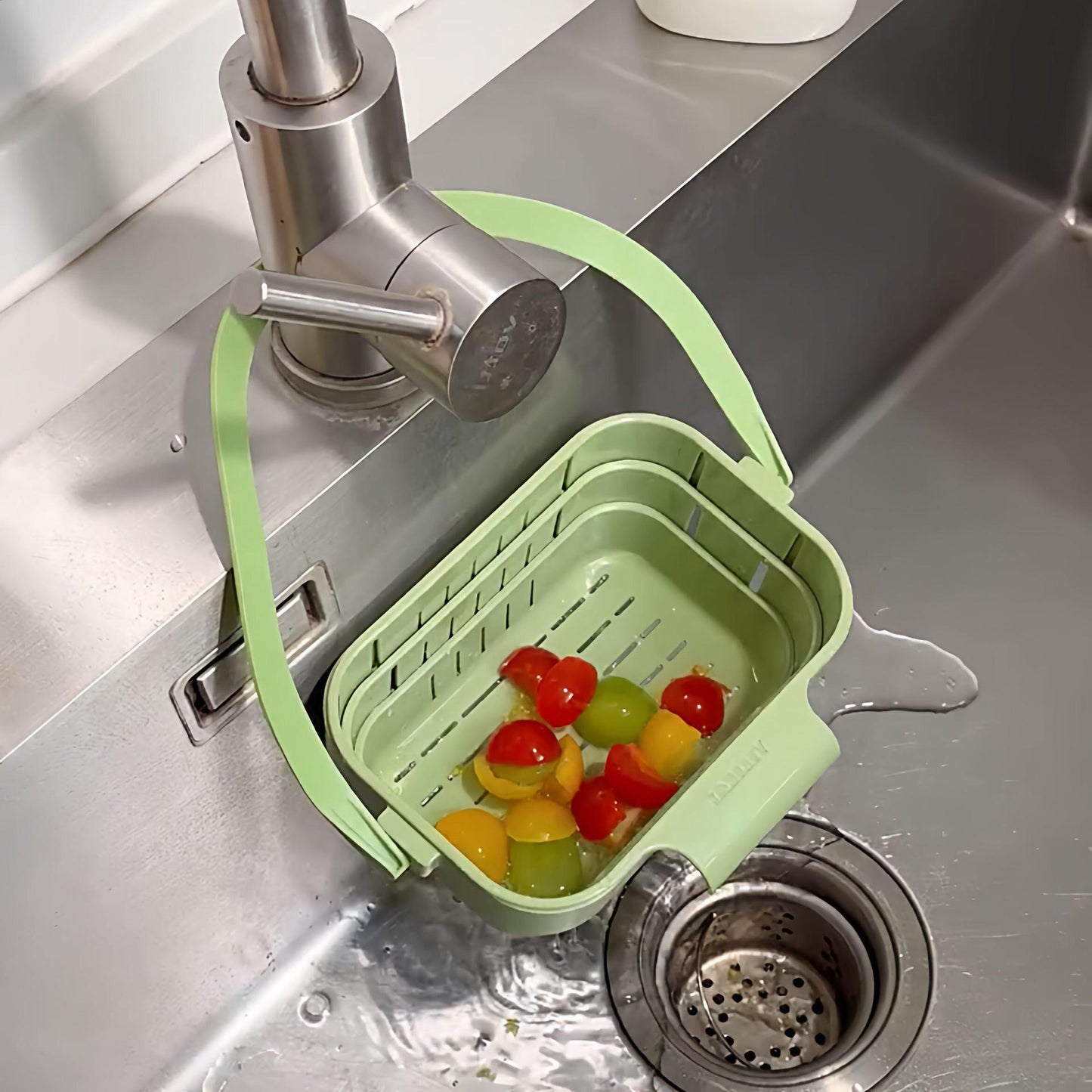 Hanging, foldable, and telescopic dish drying basket for kitchen sinks — separates food residue and filters fruits during washing and storage.